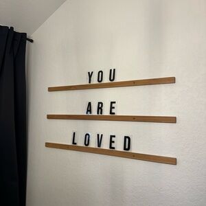 Letter ledges with black letters